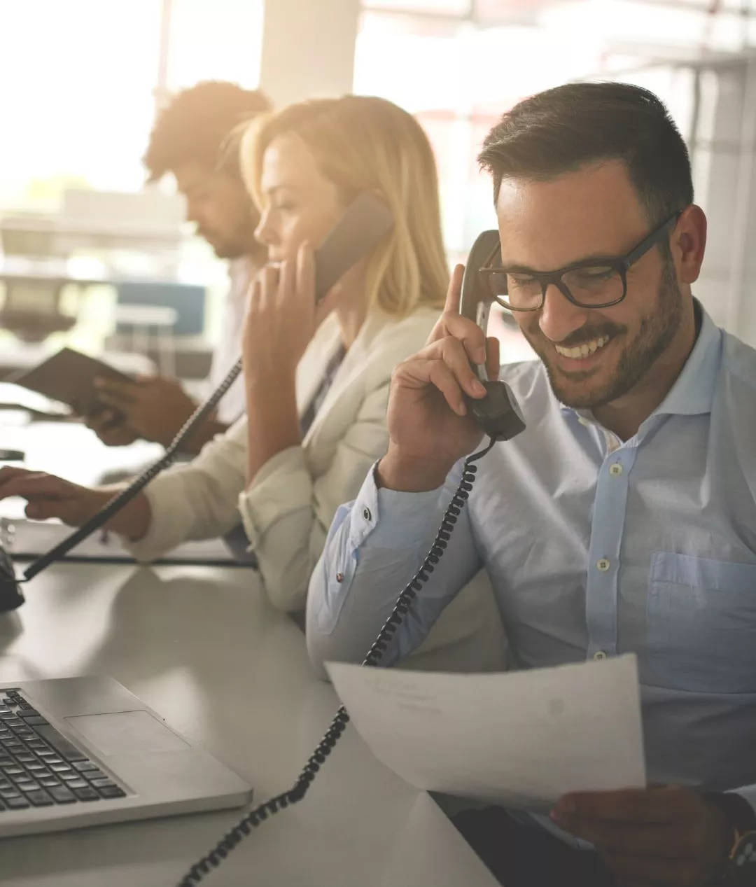 People in call center talking over the phone